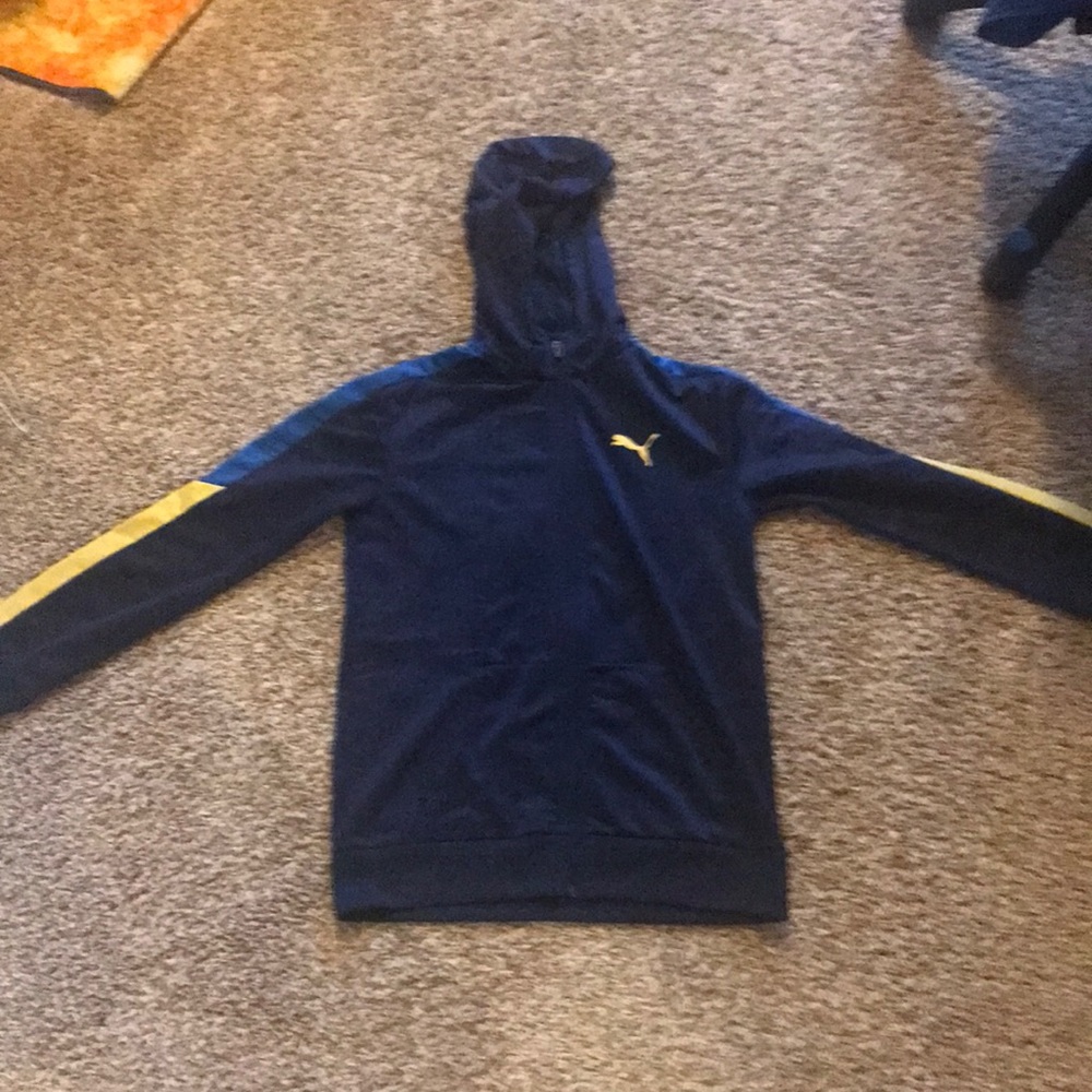 Dark blue puma brand hoodie with yellow and blue. Size 14-16